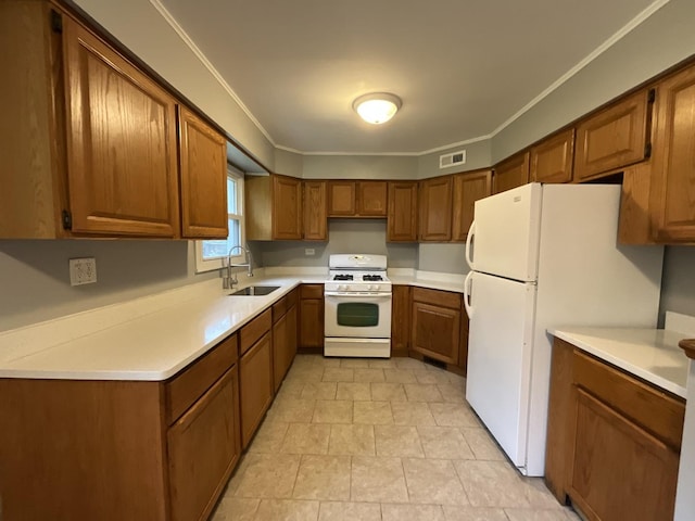 kitchen with white appliances, crown molding, and sink