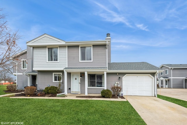 front of property with a front yard and a garage