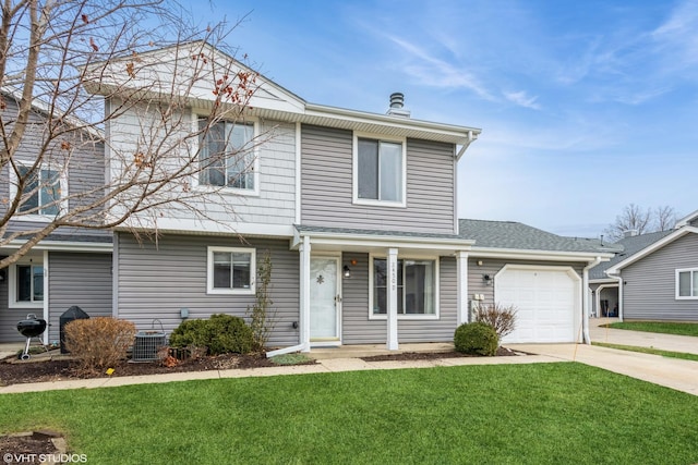 view of front property with a garage and a front lawn