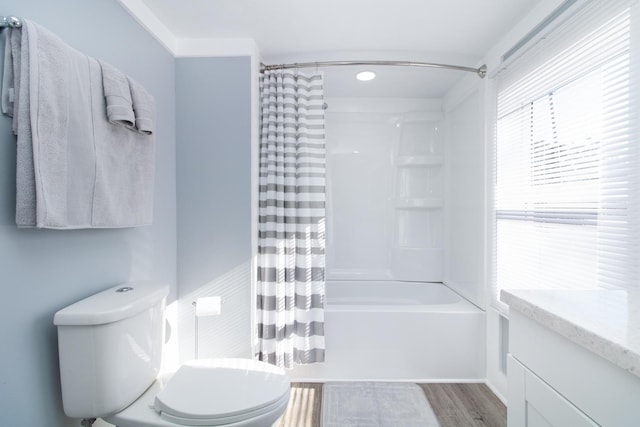 full bathroom featuring toilet, shower / bath combo, wood-type flooring, and vanity