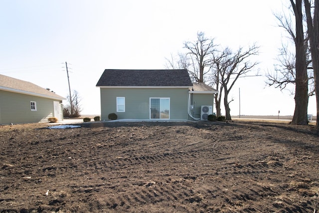 rear view of property featuring ac unit