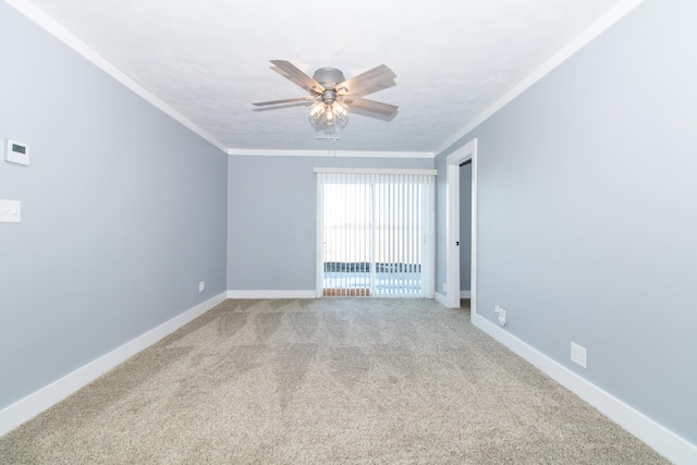 unfurnished room with ceiling fan, ornamental molding, and carpet