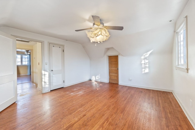 bonus room with ceiling fan, light hardwood / wood-style flooring, and lofted ceiling