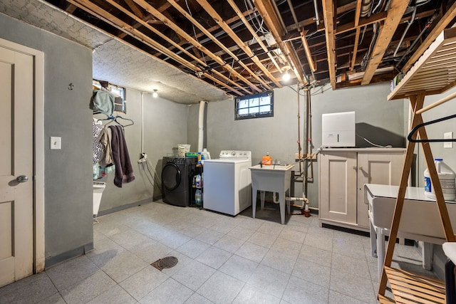 laundry room with sink and separate washer and dryer