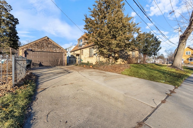 exterior space featuring a garage and a yard