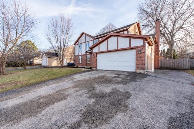 view of home's exterior with a yard and a garage