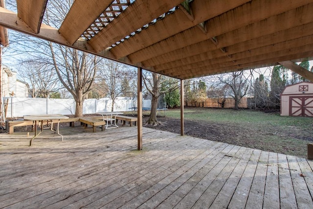 wooden deck featuring a storage unit