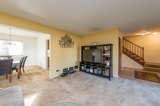 living room featuring carpet and a chandelier