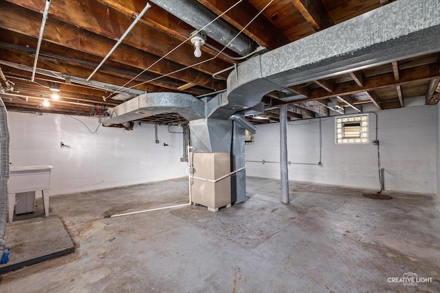 basement featuring heating unit