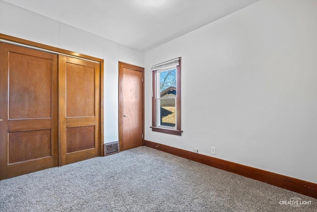 unfurnished bedroom with carpet floors