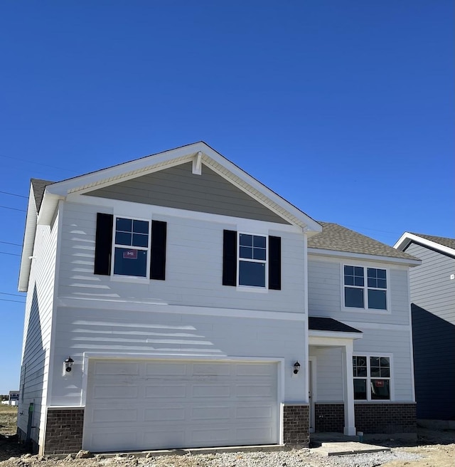 view of front of property featuring a garage