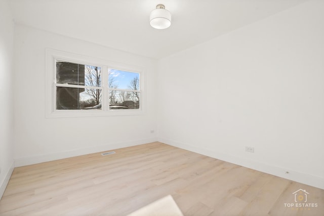 unfurnished room featuring light hardwood / wood-style floors