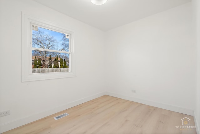 unfurnished room featuring light hardwood / wood-style flooring