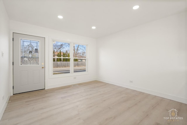 spare room featuring light hardwood / wood-style flooring