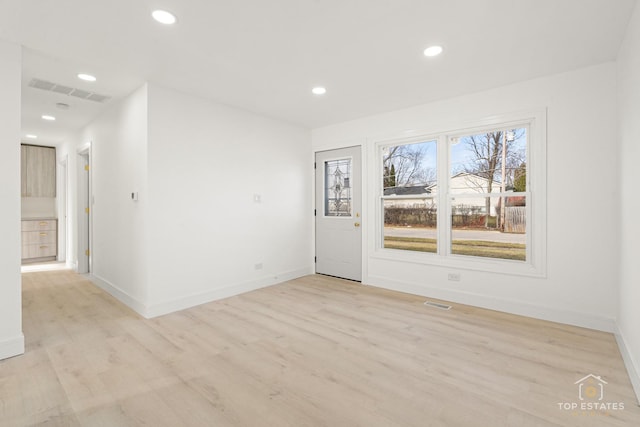 unfurnished room featuring light hardwood / wood-style floors