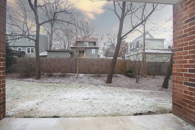 view of yard at dusk