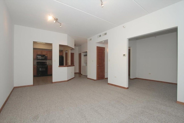 unfurnished living room with light carpet