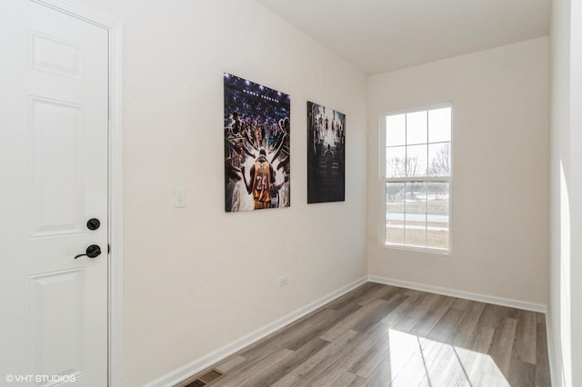 spare room featuring light hardwood / wood-style flooring