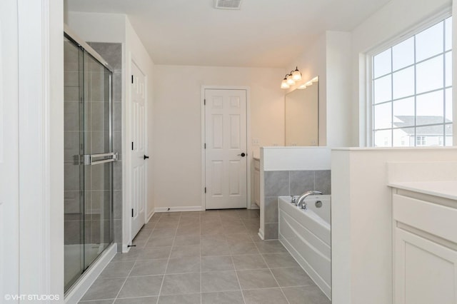 bathroom featuring tile patterned floors, vanity, and independent shower and bath