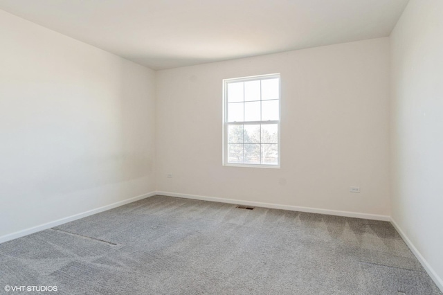 spare room featuring carpet floors