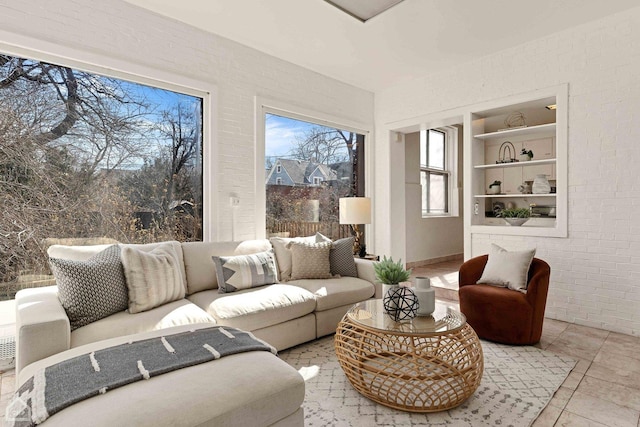5645 S Woodlawn Ave, Chicago, IL 60637 - tiled living room featuring brick wall and built in features