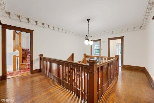 5645 S Woodlawn Ave, Chicago, IL 60637 - hallway featuring wood finished floors, an upstairs landing, and baseboards