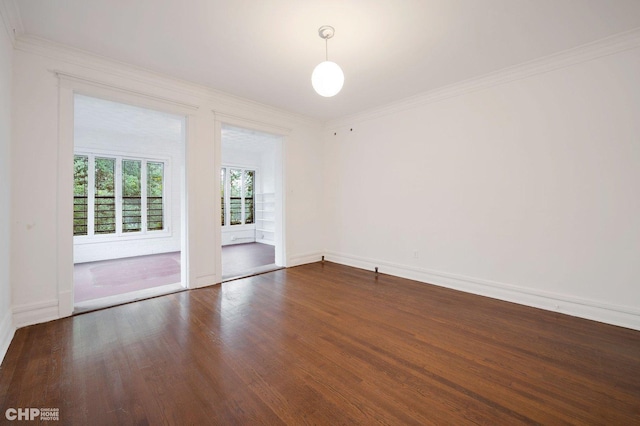 5645 S Woodlawn Ave, Chicago, IL 60637 - spare room with ornamental molding, baseboards, and wood finished floors