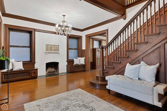 5645 S Woodlawn Ave, Chicago, IL 60637 - living area featuring a fireplace with flush hearth, stairs, ornamental molding, and wood finished floors
