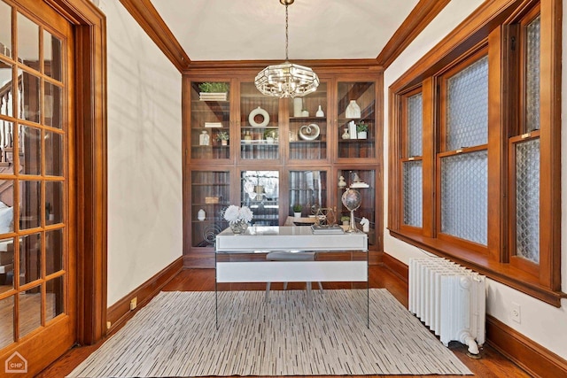 5645 S Woodlawn Ave, Chicago, IL 60637 - unfurnished dining area with dark wood-type flooring, an inviting chandelier, and radiator