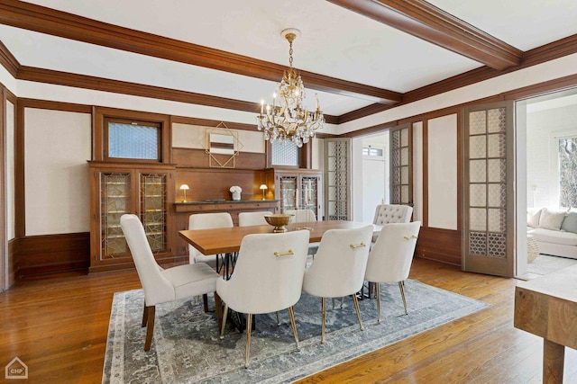 5645 S Woodlawn Ave, Chicago, IL 60637 - dining area with hardwood / wood-style flooring, a notable chandelier, a wealth of natural light, and beamed ceiling
