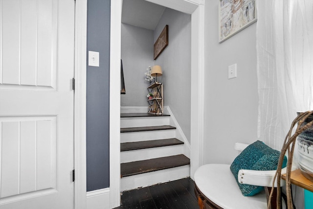 stairway featuring wood-type flooring