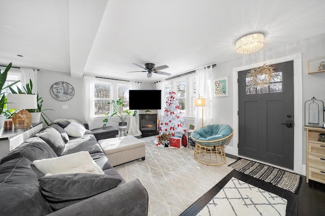 living room featuring ceiling fan and light wood-type flooring