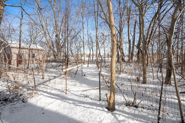 view of yard layered in snow