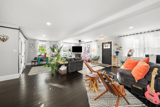 living room with dark hardwood / wood-style floors and ceiling fan