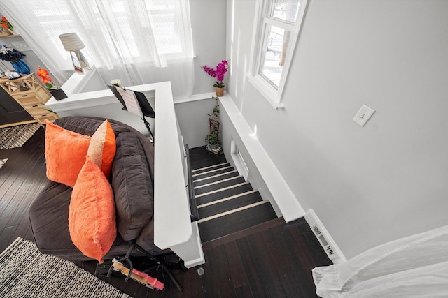 stairway featuring hardwood / wood-style floors