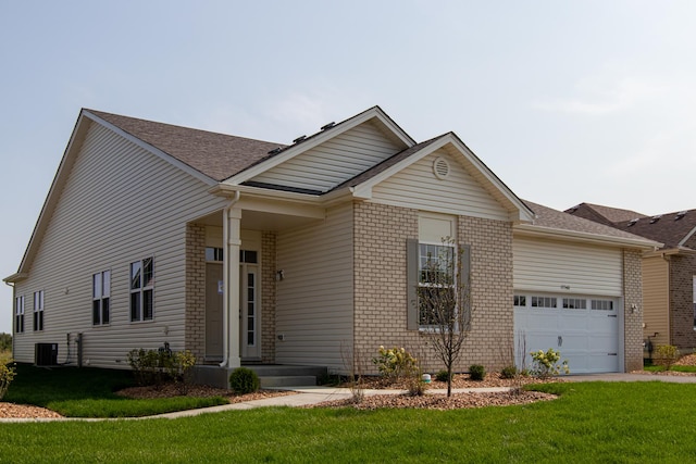 view of front facade with central air condition unit, a front yard, and a garage