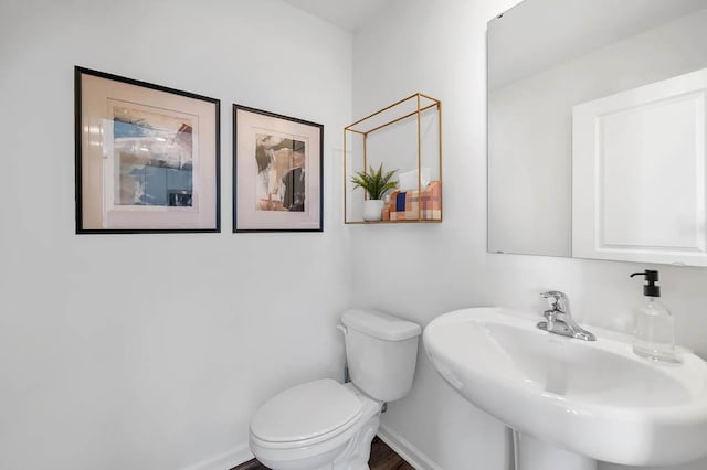 bathroom with toilet and sink