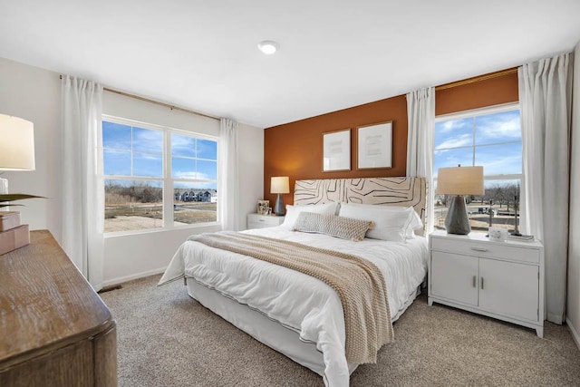 bedroom with light colored carpet