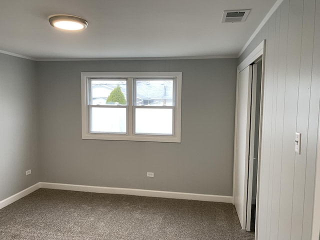 unfurnished bedroom with carpet flooring and ornamental molding