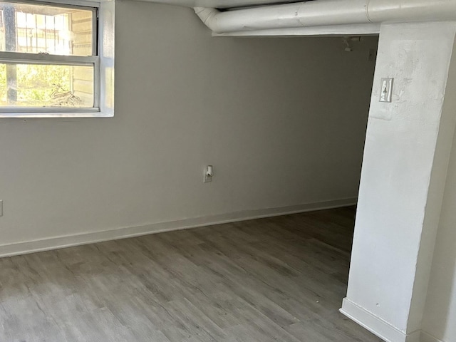 spare room featuring wood-type flooring