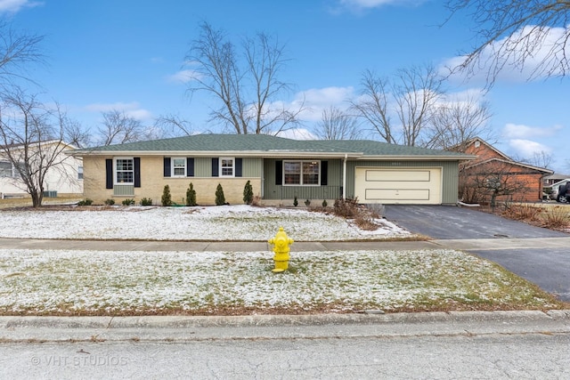 ranch-style home with a garage