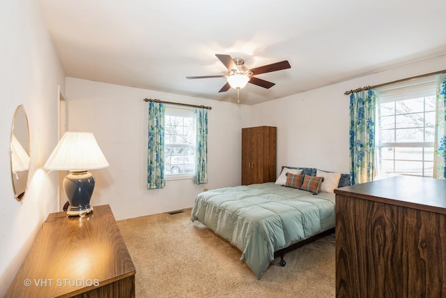 carpeted bedroom with ceiling fan