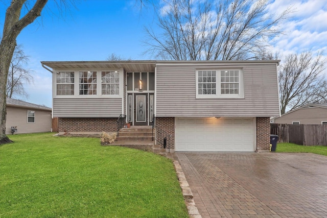 view of front facade with a garage and a front lawn