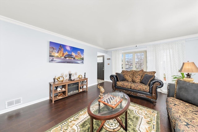 living room featuring crown molding and dark wood-type flooring