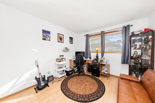 home office with hardwood / wood-style flooring