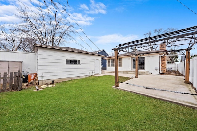 rear view of house featuring a lawn, a patio area, and a pergola