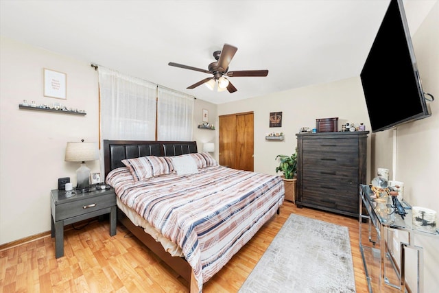 bedroom with ceiling fan and light hardwood / wood-style flooring