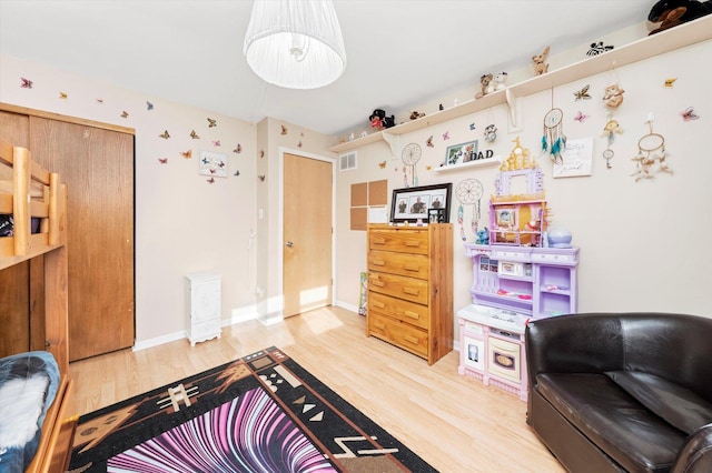 living area featuring hardwood / wood-style floors