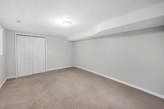 unfurnished bedroom with carpet floors and a closet