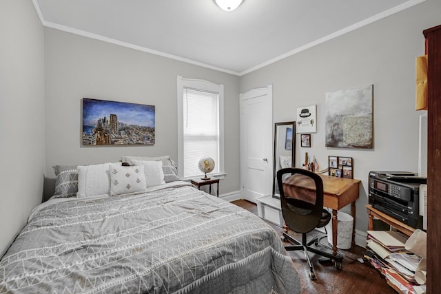 bedroom featuring crown molding and dark hardwood / wood-style floors